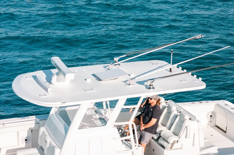 Slide: The Image of 2021 Invincible 37 Catamaran cruising on blue ocean waters. - 8