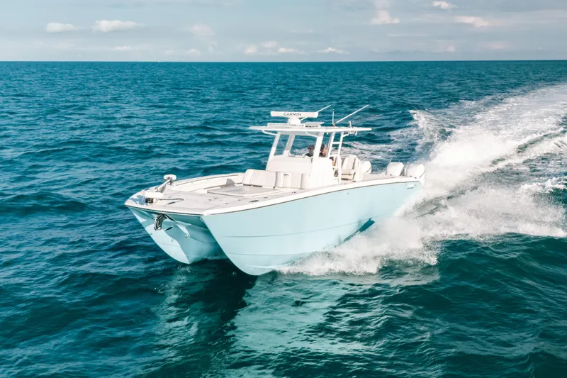 Slide: The Image of Invincible 37 Catamaran 2021 cruising on open ocean waters. - 9