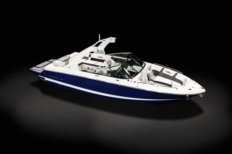Slide: The Image of 2021 Chaparral 30 Surf boat, sleek design, white and blue exterior, luxury seating. - 10