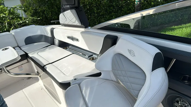 Slide: The Image of 2021 Chaparral 30 Surf boat interior with white seating and modern design. - 3