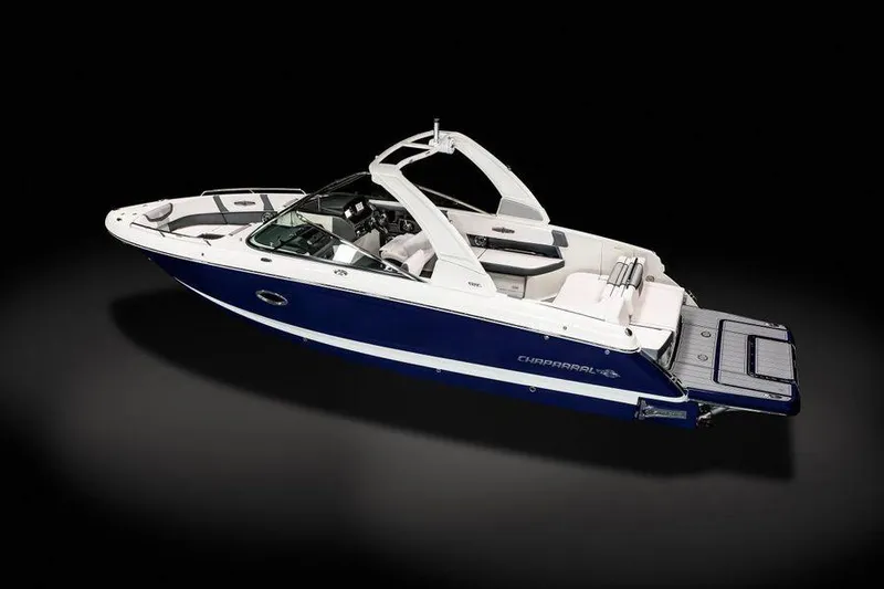 Slide: The Image of 2021 Chaparral 30 Surf boat, sleek design, blue and white exterior, modern features. - 9