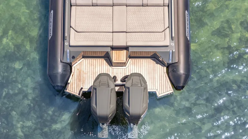 Slide: The Image of Aerial view of 2025 Skipper-BSK 38 boat with twin engines on clear water. - 34