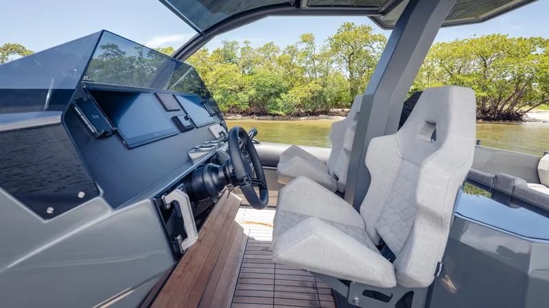 Slide: The Image of Interior of 2025 Skipper-BSK 38 boat with modern dashboard and comfortable seating. - 43