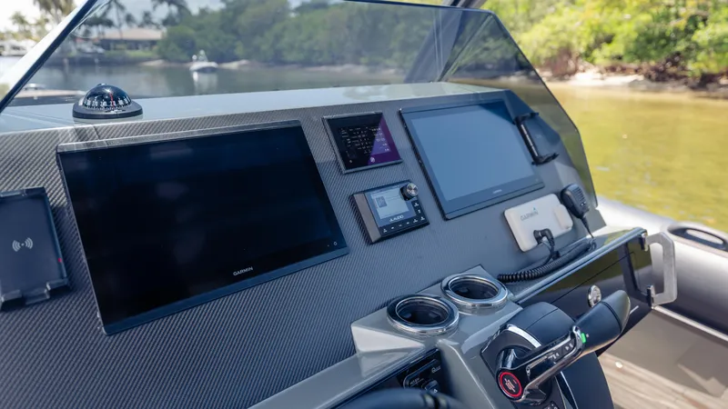 Slide: The Image of Helm of 2025 Skipper-BSK 38 boat with advanced navigation displays and controls. - 46