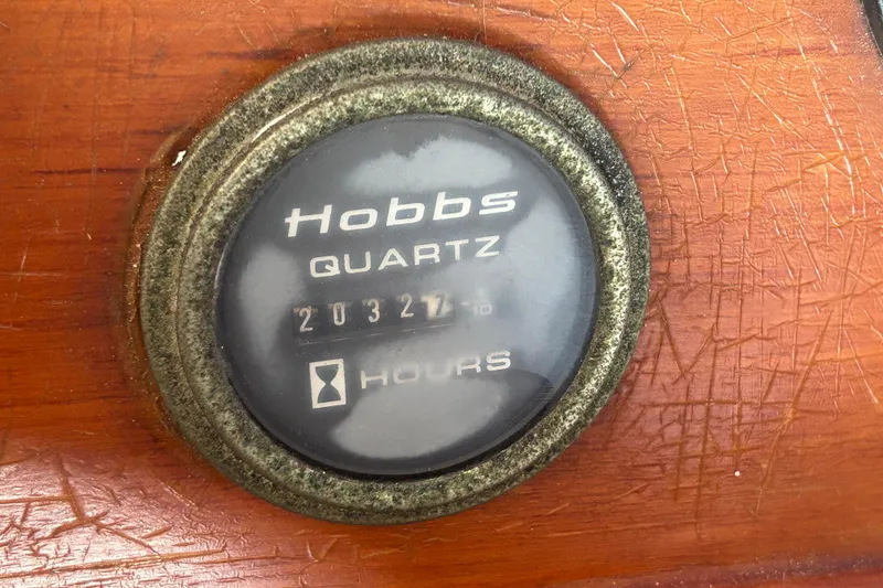 Slide: The Image of Interior of a 1973 Grand Banks 32 Sedan with blue seating and wooden accents. - 13