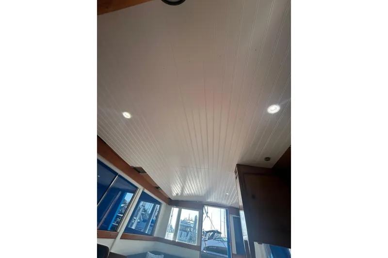 Slide: The Image of Interior ceiling of a 1973 Grand Banks 32 Sedan boat with recessed lighting. - 35