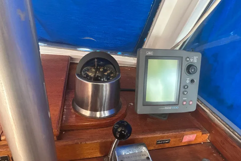 Slide: The Image of 1973 Grand Banks 32 Sedan dashboard with compass and JRC Radar 1500. - 45