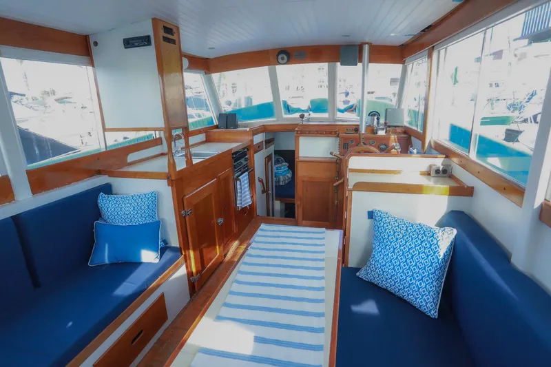 Slide: The Image of Interior of a 1973 Grand Banks 32 Sedan with blue seating and nautical decor. - 8