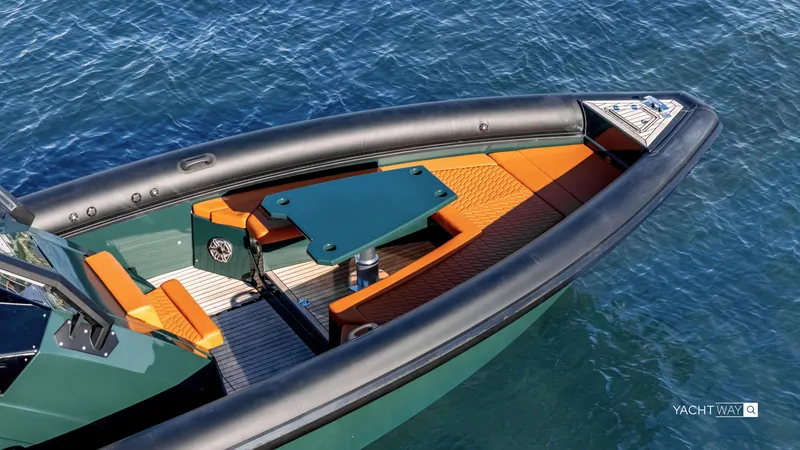 Slide: The Image of Skipper-BSK 38 (2025) boat with orange seating and teal table on blue water. - 30