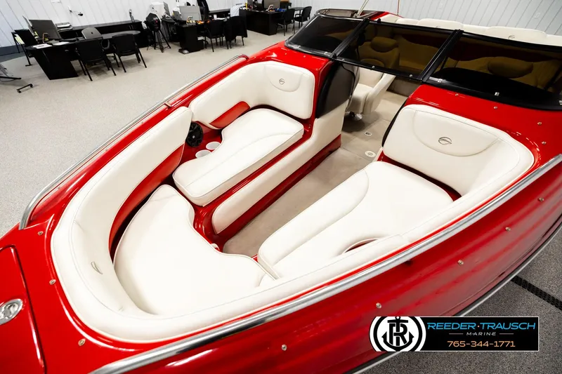 Slide: The Image of 2005 Crownline 225 LPX boat with red exterior and white interior seating. - 10