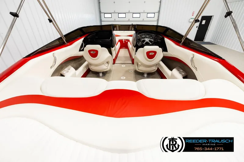 Slide: The Image of 2005 Crownline 225 LPX boat interior with red and white seating, steering wheel, and controls. - 13