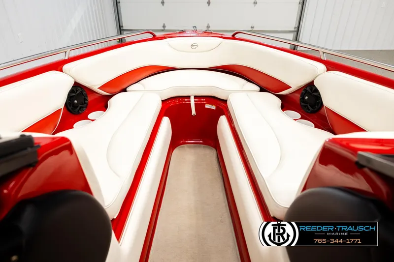 Slide: The Image of 2005 Crownline 225 LPX boat interior with red and white seating, featuring speakers. - 15