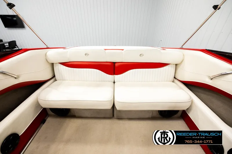 Slide: The Image of 2005 Crownline 225 LPX boat interior with white and red seating, Reeder Trausch Marine logo. - 19