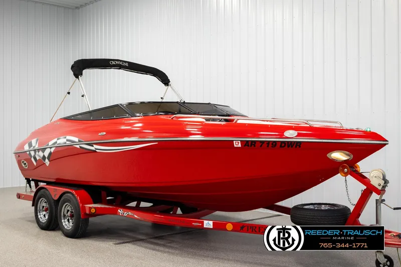 Slide: The Image of Red 2005 Crownline 225 LPX boat on trailer in indoor showroom. - 2