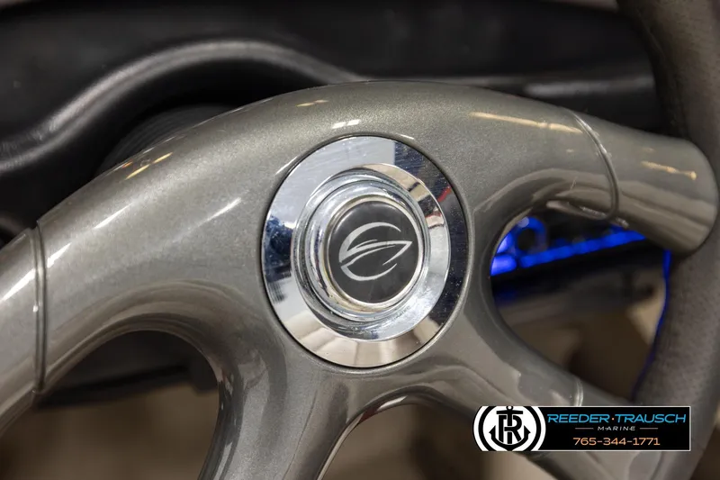 Slide: The Image of Steering wheel of 2005 Crownline 225 LPX boat, featuring sleek metallic design. - 25