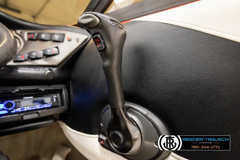 Slide: The Image of 2005 Crownline 225 LPX boat interior with control lever and dashboard details. - 30