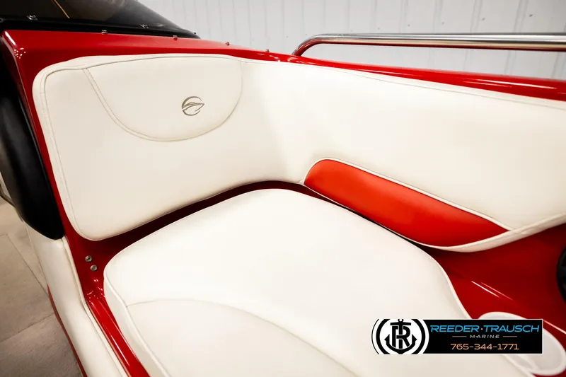 Slide: The Image of 2005 Crownline 225 LPX boat interior with white and red seating, Reeder-Trausch Marine logo. - 33