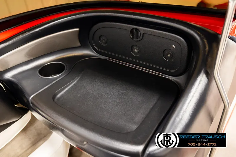 Slide: The Image of 2005 Crownline 225 LPX boat interior with cup holder and storage compartment. - 36
