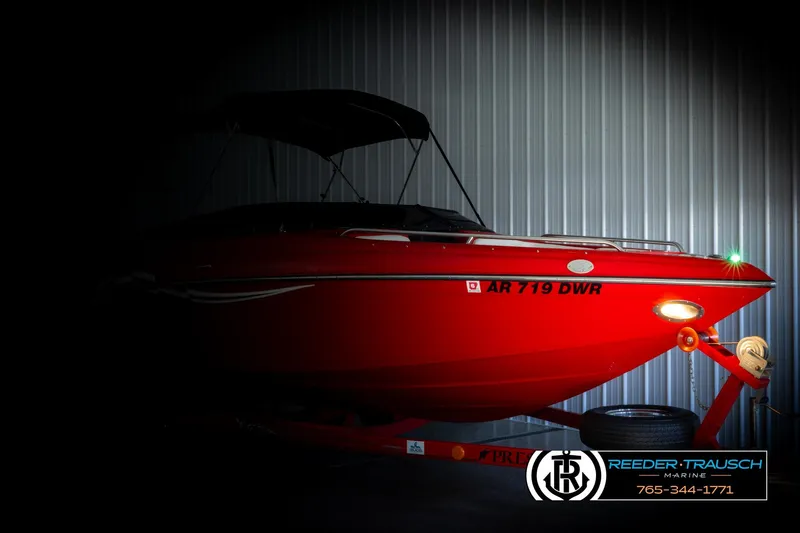 Slide: The Image of 2005 Crownline 225 LPX boat in a dimly lit storage area. - 4