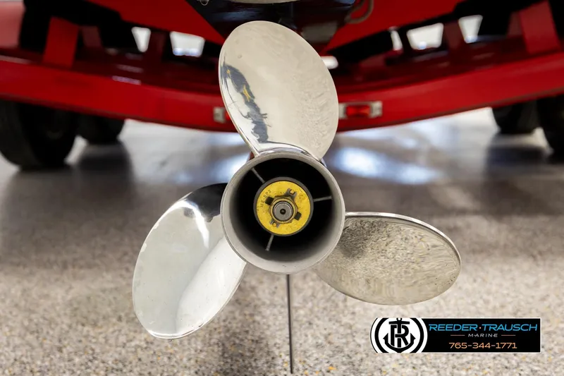 Slide: The Image of Close-up of a 2005 Crownline 225 LPX boat propeller with red trailer background. - 41