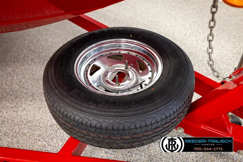 Slide: The Image of Spare tire on red trailer for 2005 Crownline 225 LPX boat. - 42