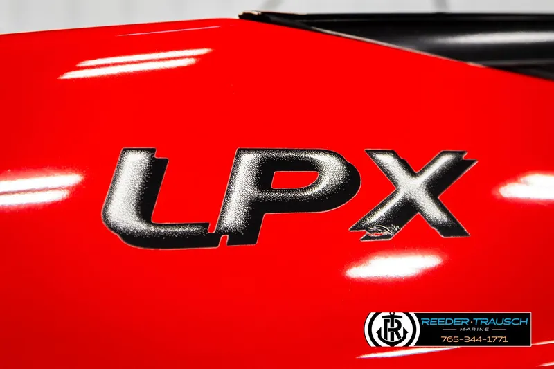 Slide: The Image of Red 2005 Crownline 225 LPX boat with bold LPX lettering and Reeder-Trausch Marine logo. - 45