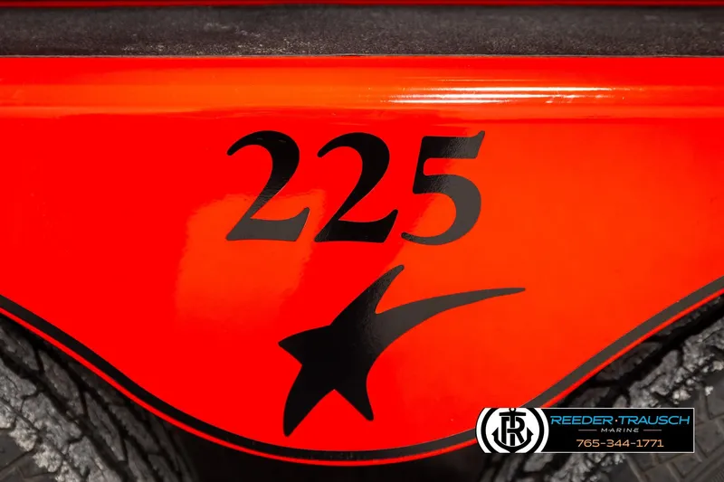 Slide: The Image of 2005 Crownline 225 LPX boat, vibrant red with black star design, Reeder-Trausch Marine logo. - 46