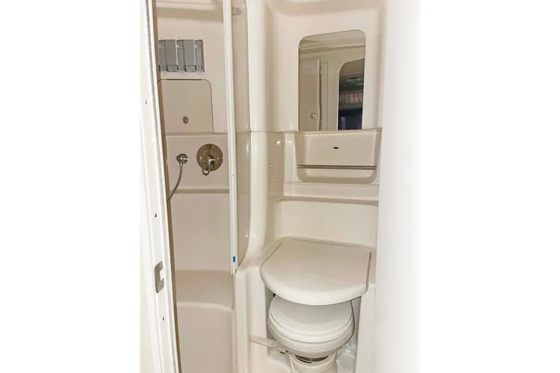 Slide: The Image of Bathroom interior of 2004 Sea Ray 380 Sundancer yacht, featuring shower and toilet. - 13