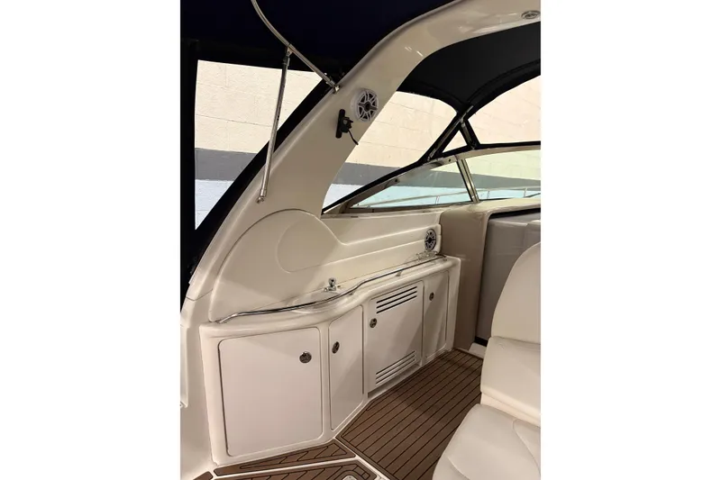 Slide: The Image of 2004 Sea Ray 380 Sundancer interior with sleek cabinetry and modern design. - 17