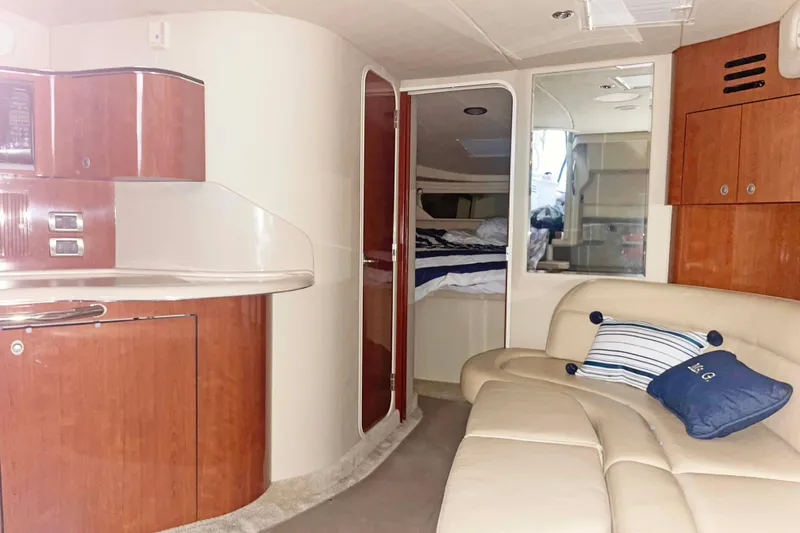 Slide: The Image of Luxurious interior of 2004 Sea Ray 380 Sundancer yacht with elegant wood finishes. - 24