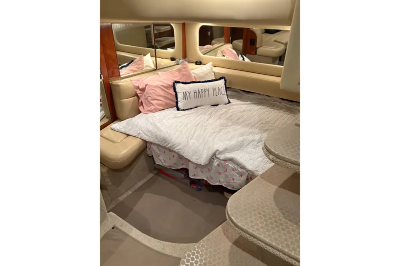 Slide: The Image of Cozy cabin interior of 2004 Sea Ray 380 Sundancer with comfortable bedding and pillows. - 28