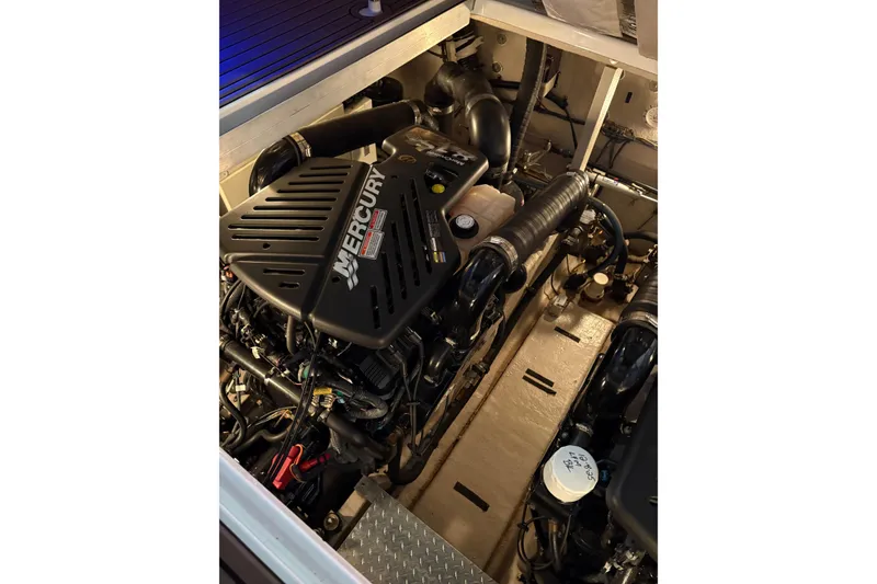 Slide: The Image of Engine compartment of a 2004 Sea Ray 380 Sundancer with Mercury engine. - 37