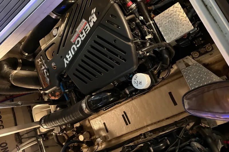 Slide: The Image of Engine compartment of a 2004 Sea Ray 380 Sundancer with Mercury engine. - 38