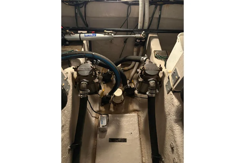 Slide: The Image of Engine compartment of a 2004 Sea Ray 380 Sundancer boat, showing mechanical components. - 43