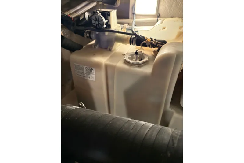 Slide: The Image of Engine compartment of 2004 Sea Ray 380 Sundancer showing fuel tank and hoses. - 46