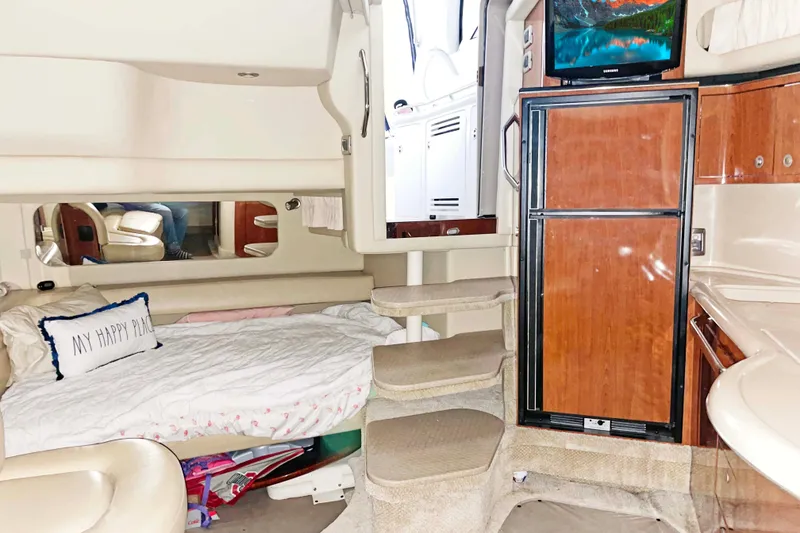 Slide: The Image of Interior of 2004 Sea Ray 380 Sundancer yacht with cozy bed and modern amenities. - 7