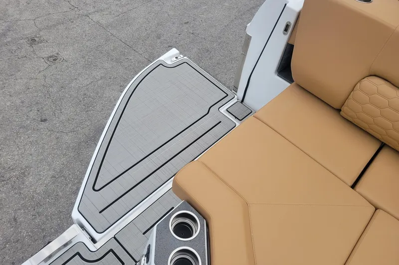 Slide: The Image of 2026 Four Winns H33 OB boat with tan seating and gray deck. - 20