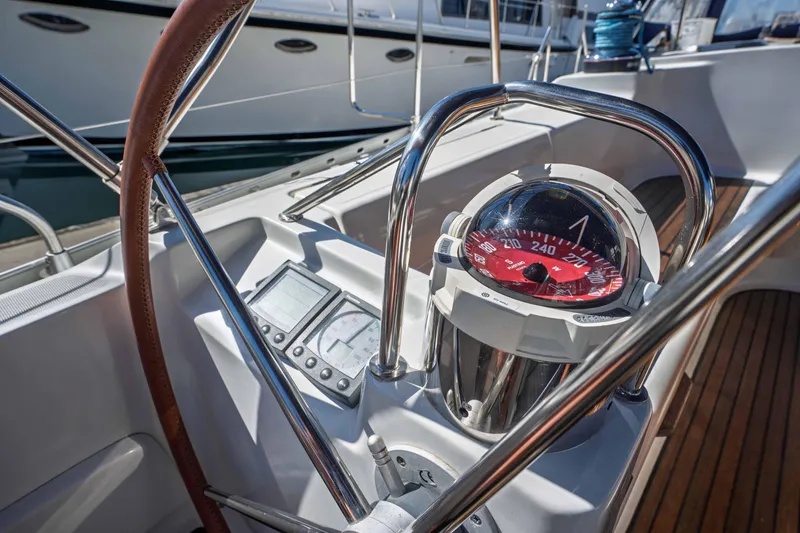 Slide: The Image of Cockpit of 2003 Jeanneau Sun Odyssey 45.2 sailboat with compass and navigation instruments. - 27