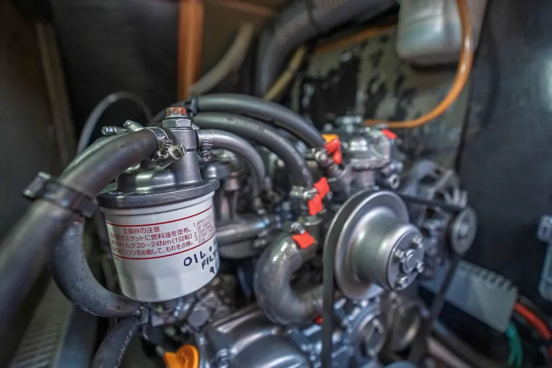 Slide: The Image of Engine compartment of 2003 Jeanneau Sun Odyssey 45.2 sailboat, showing detailed components. - 77