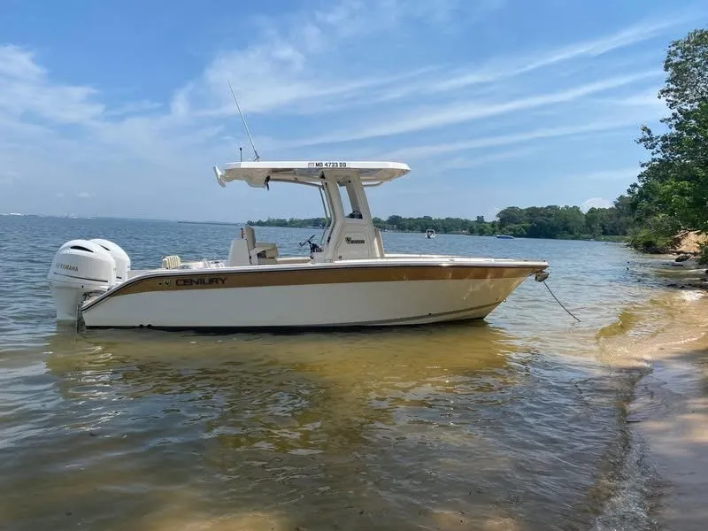 The Image of 2021 Century 2400 boat by a lake shore. - 0