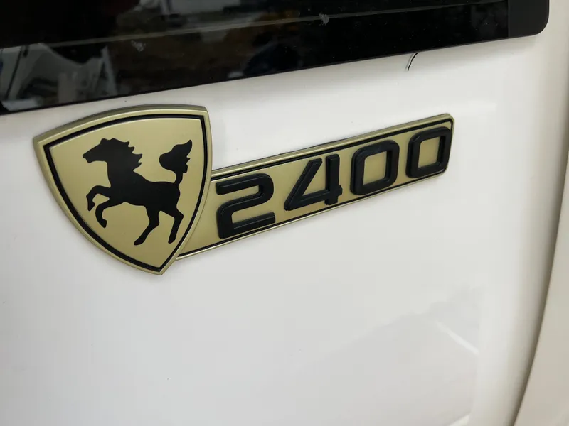 Slide: The Image of Century 2400 emblem with horse symbol, model year 2021. - 11