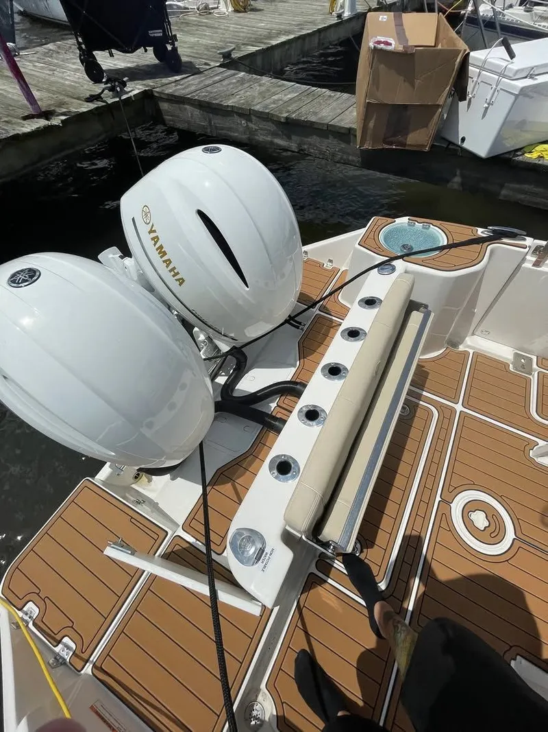 Slide: The Image of Century 2400 boat from 2021 with Yamaha engines at dock. - 3