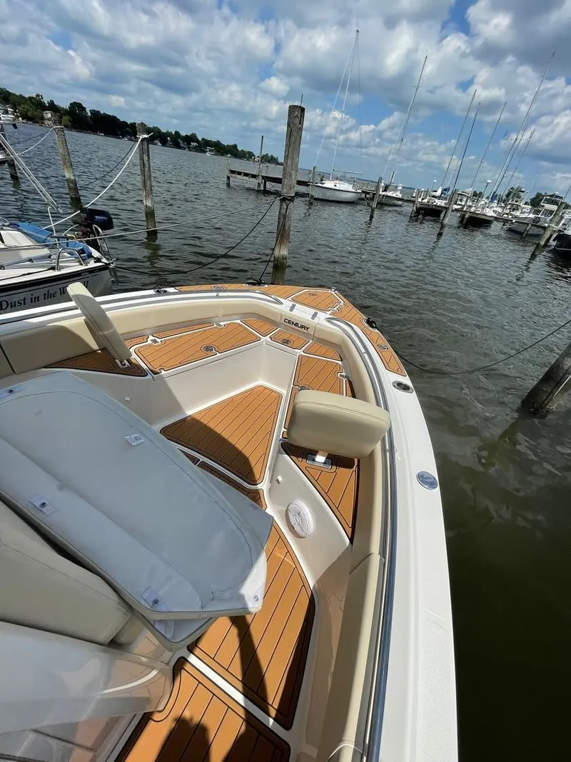 Slide: The Image of Century 2400 boat from 2021 docked, sunny day. - 5