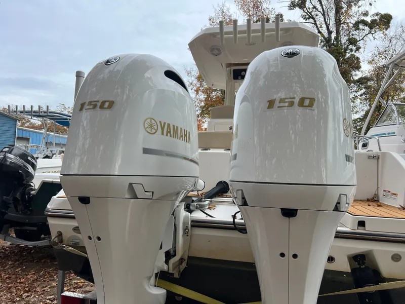 Slide: The Image of Two Yamaha 150 outboard motors on a 2021 Century 2400 boat. - 9