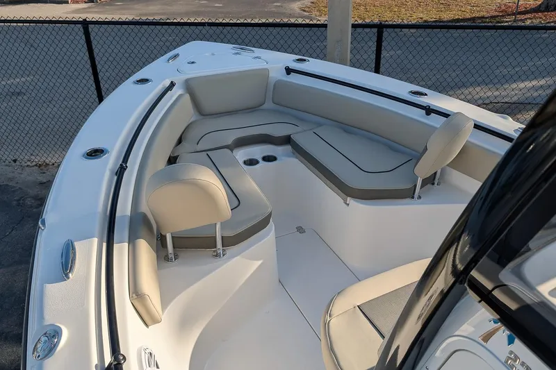 Slide: The Image of 2026 Key West 239 FS boat interior with cushioned seating and cup holders. - 15