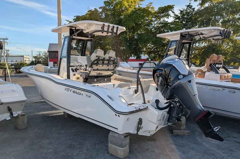 Slide: The Image of 2026 Key West 239 FS boat with outboard motor on display. - 2