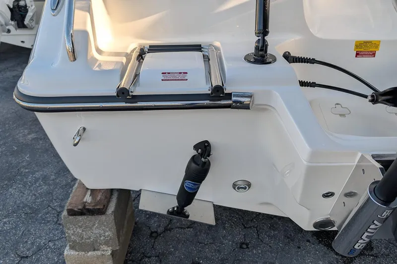 Slide: The Image of 2026 Key West 239 FS boat stern with ladder and hydraulic components. - 4