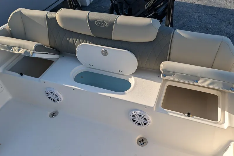 Slide: The Image of 2026 Key West 239 FS boat interior with seating and storage compartments. - 7