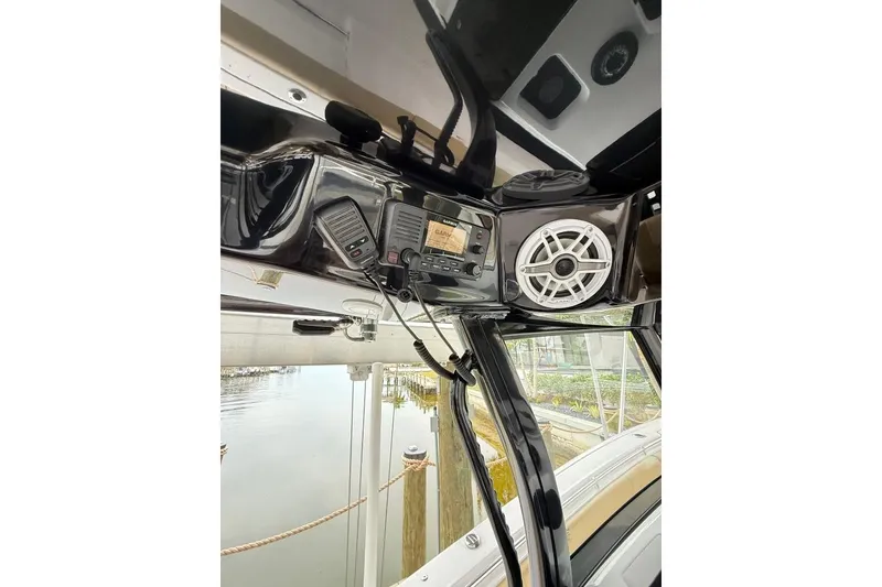 Slide: The Image of 2025 Sportsman Open 352 Center Console dashboard displaying engine hours and odometer statistics. - 13