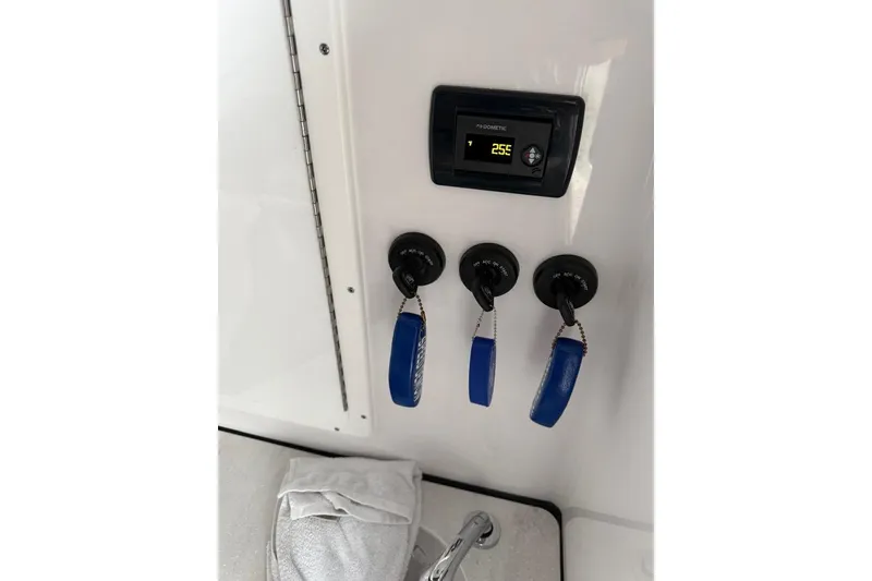 Slide: The Image of Interior of 2025 Sportsman Open 352 Center Console with storage and equipment. - 18